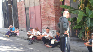 People on Cosmo Street sitting on the sidewalk in flagrant violation of Los Angeles Municipal Code §41.18(d) and not being arrested by the BID patrol