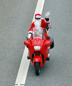 Über-cool Hollywood Santa on his BMW bike... no room for an iMac in that sack!