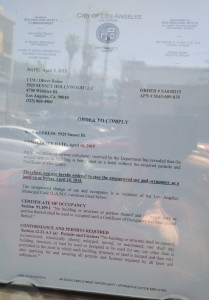 First page of Order to Comply posted in the window of the CiM Group crime scene at Sunset and Gordon.  The second page is available here.