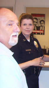 Exceedingly powerful LAPD officer Bea Girmala, pictured here with sidelong-glancing former Inglewood PD guy Steve Seyler who, we gotta admit, has nothing to do with this story, but here he is in the picture anyway.