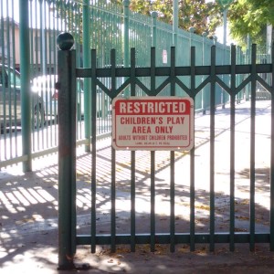 One of the legitimate, Recreation and Parks Commission approved, signs at Selma Park stating that use of the playground is restricted to children and caregivers.