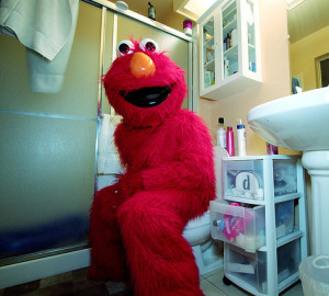 What laws are being violated here?  Is the photographer violating trademarks?  Performance rights?  Right of publicity?  Are we violating any of these rights by republishing this photo?  I guess we're gonna find out!  At least the BID Patrol can't pop old Elmo for violating LAMC 41.47.2.