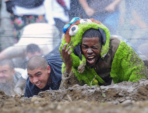 This is a guy in the U.S. Army wearing an Oscar the Grouch costume and crawling through the mud in what the photographer calls a "morale-building event."  Where are the C&D letters to the U.S. Army?!?  How can they claim to be defending our nation's freedom when they're infringing on Sesame Workshop's valuable intellectual property?!!?!
