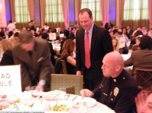 Adam Schiff hovering over a full-mouthed Peter Zarcone at one of those rubber chicken extravaganzas.