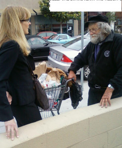 Kerry Morrison in 2010 explaining to a homeless man why she's allowed to sit on the sidewalk but he isn't.