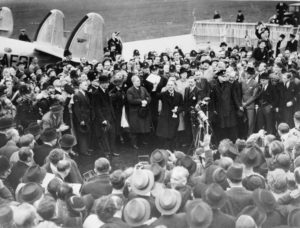 Councilmember Mitch O'Farrell holds up copy of agreement with HPOA Executive Director Kerry Morrison announcing his willingness to cede control over the Sudetenland Hollywood and Highland to her in exchange for peace in our time.