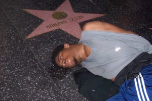 After the handcuffs were forcibly placed on this man's wrists he lies prone on the walk of fame.
