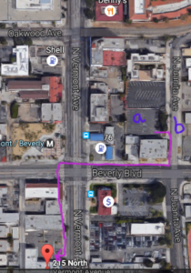 Map of the area.  (a) is the parking lot, (b) is the encampment.  A speculative VIP path to the event is shown in purple.  Click to enlarge.