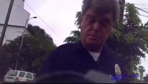 LAPD Officer Stuart Jaye blocking documentary photographer Shawn Nee from filming police activity on July 5, 2015.